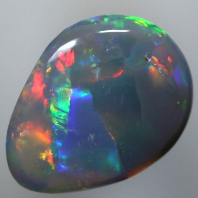 SOLID SEMI BLACK OPAL Large rainbow rolling flashes. Bright.